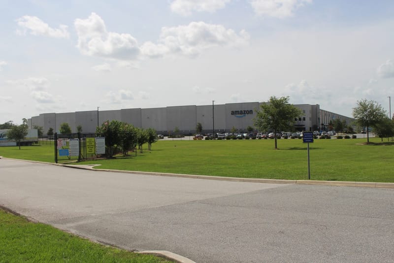 Exterior of a large Amazon fulfillment center building in Ocala, Florida