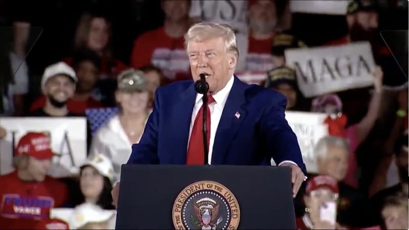 Donald Trump speaking at an earlier rally in Warren, Michigan, in April 2025