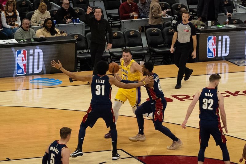Luka Doncic of the Los Angeles Lakers dribbling against Cleveland Cavaliers defenders in January 2026