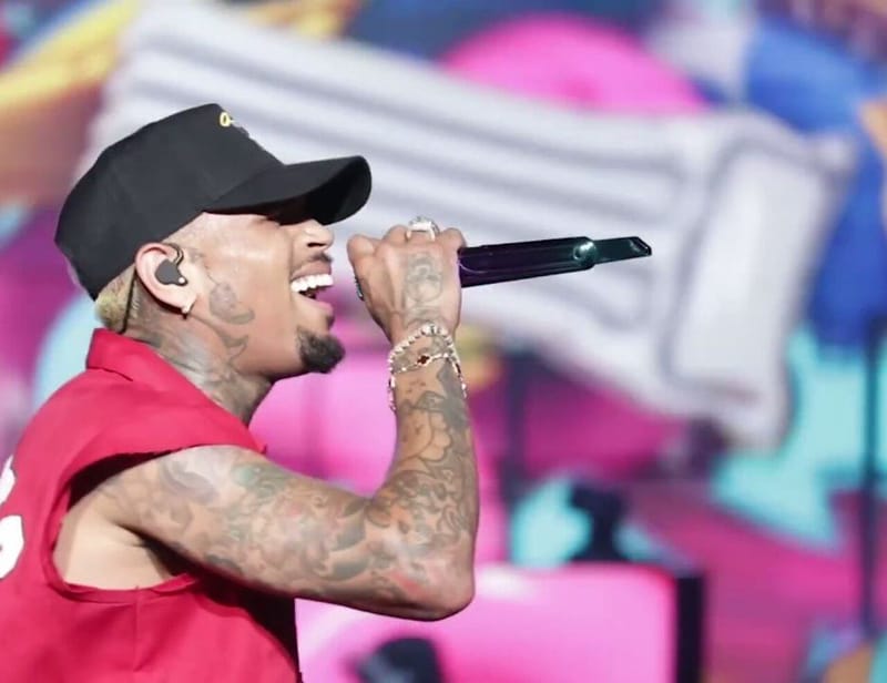 Singer Chris Brown performing on stage at Jamaica National Stadium during his Under the Influence Tour in 2023