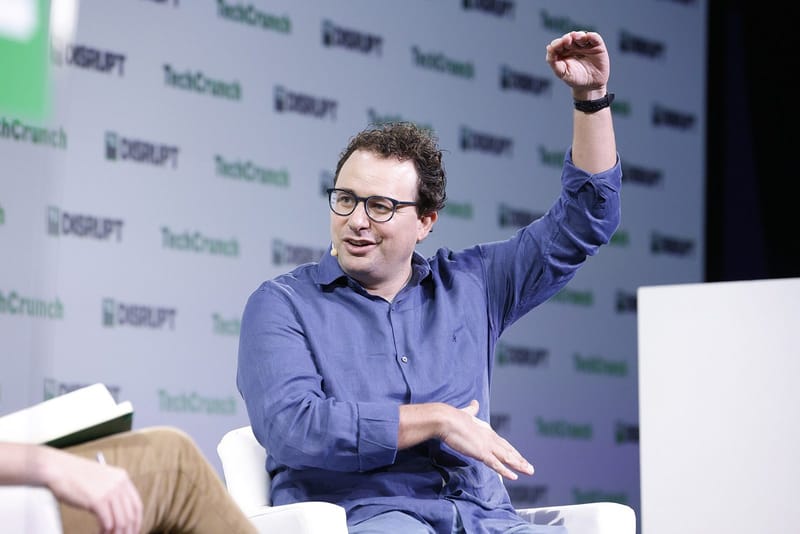 Anthropic CEO Dario Amodei speaking on stage at TechCrunch Disrupt 2023